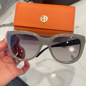 Tory Burch gray frame sunglasses.